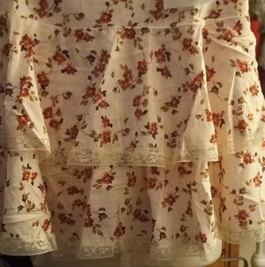 New,tag,floral 2 ruffle mini skirt lace trim& underneath skort lining size med.